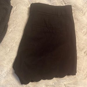 Black scalloped edge shorts.